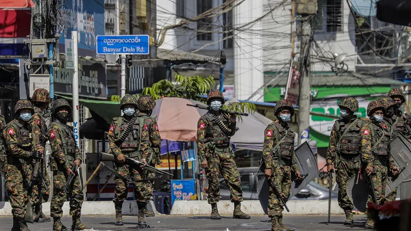 epa09055654 Soldiers patrol on the street during a protest against the military coup in Yangon, Myanmar, 06 March 2021. Anti-coup protests continued despite the intensifying violent crackdowns on demonstrators by security forces. More than 50 people have died in the crackdown by security forces, since the military coup on 01 February 2021. EPA/LYNN BO BO