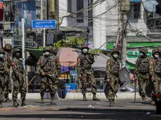 epa09055654 Soldiers patrol on the street during a protest against the military coup in Yangon, Myanmar, 06 March 2021. Anti-coup protests continued despite the intensifying violent crackdowns on demonstrators by security forces. More than 50 people have died in the crackdown by security forces, since the military coup on 01 February 2021. EPA/LYNN BO BO