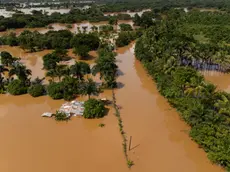 epa10986590 Aerial view of the fields and the Santo Domingo Ring Road, affected by the intense rains in Aguacate, Dominican Republic, 20 November 2023. The Dominican authorities raised the official number of deaths to 24 as a result of the torrential rains that affected that country over the weekend and that have also left thousands of people displaced, damage to homes and infrastructure, as well as power and water outages. EPA/Orlando Barria