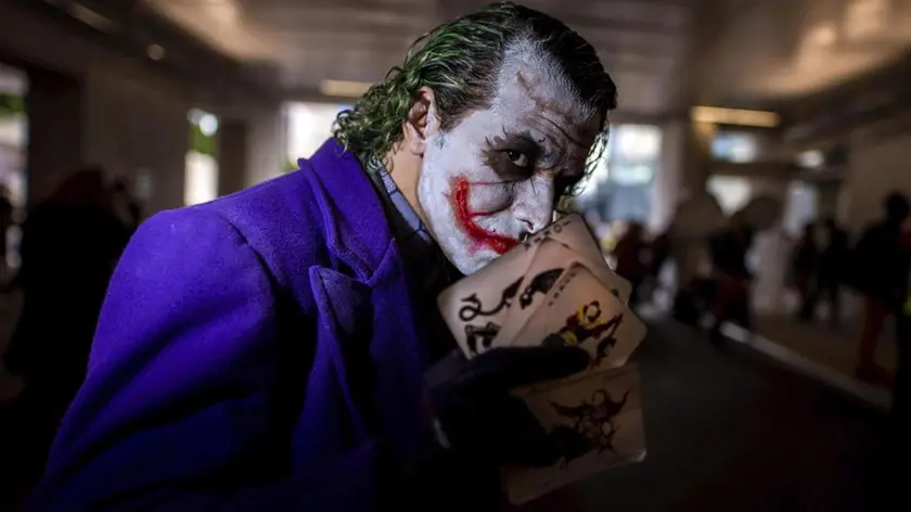 An attendee dressed as the Joker poses during New York Comic Con at the Jacob K. Javits Convention Center on Friday, Oct. 4, 2019, in New York. (Photo by Charles Sykes/Invision/ANSA/AP) [CopyrightNotice: 2019 Invision]
