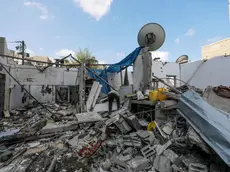epa11548253 A Palestinian inspects a destroyed house following an Israeli air strike in Al Maghazi refugee camp, Gaza Strip, 14 August 2024. The Palestinian Health Ministry in Gaza said at least six Palestinians were killed from the Eid family in the Israeli strike in the Al Maghazi refugee camp and more than 10 others were injured. More than 39,500 Palestinians and over 1,400 Israelis have been killed, according to the Palestinian Health Ministry and the Israel Defense Forces (IDF), since Hamas militants launched an attack against Israel from the Gaza Strip on 07 October 2023, and the Israeli operations in Gaza and the West Bank which followed it. EPA/MOHAMMED SABER