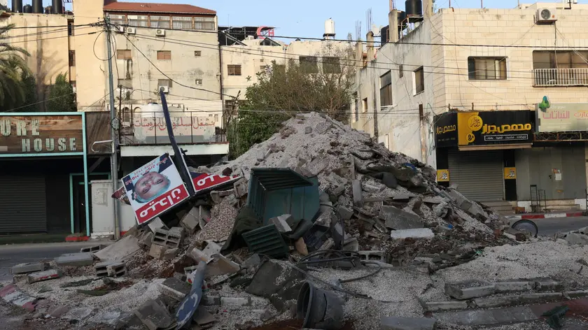 epa11358666 Rubble in a square damaged by an Israeli bulldozer during an Israeli army raid in the Jenin refugee camp, 21 May 2024. At least seven Palestinians including a doctor, a schoolteacher and two students, were killed and at least nine others injured on 21 May, after an Israeli army operation in the West Bank city of Jenin and its camp. EPA/ALAA BADARNEH