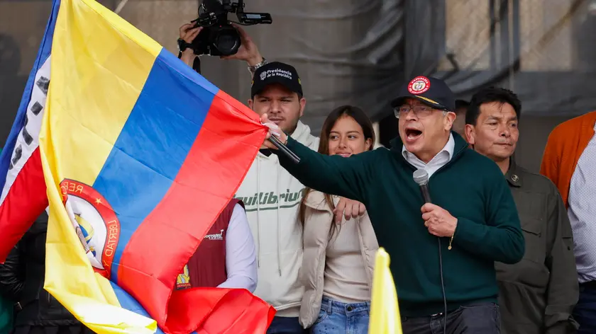 epa11313289 Colombia's President Gustavo Petro waves a Colombian national flag in the middle of his speech at the end of a demonstration to mark International Workers' Day on Wednesday at Bolivar square in Bogota, Colombia, 01 May 2024. Petro announced in a speech to workers that he will break relations with Israel on 02 May over what he called "genocide" against the Palestinian people. 'Here in front of you, the government of change, the president of the Republic, informs that tomorrow diplomatic relations with the State of Israel will be broken … for having a government, for having a genocidal president,' Petro said at the event in Bogota. EPA/Mauricio Duenas Castaneda