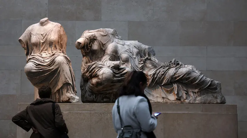 epa10998879 Visitors look at the Elgin marbles also known as the Parthenon marbles, at the British Museum in London, Britain, 28 November 2023. British Prime Minister Rishi Sunak has canceled a meeting with Greek Prime Minister Kyriakos Mitsotakis over a disagreement involving the Parthenon marbles. The marbles are a collection of Ancient Greek sculptures from the Parthenon and other structures from the Acropolis in Athens. They were removed from Ottoman Greece to Britain by 7th Earl of Elgin, and now held in the British Museum. Greece would like to see the marbles returned to Greece. EPA/ANDY RAIN