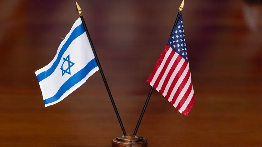 epa11244709 The national flags of Israel and the United States are placed on a table during a meeting between Israeli Defense Minister Yoav Gallant and US Secretary of Defense Lloyd Austin at the Pentagon in Arlington, Virginia, USA, 26 March 2024. Gallant's visit to the US capital comes amid high tensions between the US administration and Israel. Israeli President Netanyahu cancelled an Israeli delegation's visit to Washington in response to the US abstaining from a United Nations Security Council vote on a ceasefire in Gaza proposal. EPA/MICHAEL REYNOLDS