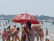 Lignano 16 Giugno 2013 turisti in spiaggia Telefoto Copyright Petrussi Foto Press /turco