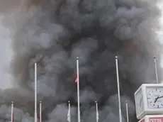 epa03815819 Smoke rises from the arrival terminal of the Jomo Kenyatta International Airport in Nairobi after a blaze, Nairobi, Kenya, 07 August 2013. A major fire forced the closure of Nairobi's main international airport early 07 August as crews battled the blaze which engulfed an entire terminal building. Parts of the roof of terminal 1 at Jomo Kenyatta International Airport collapsed in the fire, making it more difficult for fire crews to battle the blaze, which began in the early morning. EPA/STR