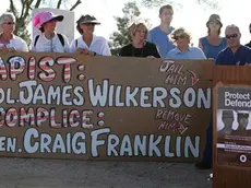 Shelli Hanks, far right, sister-in-law of Kimberly Hanks, speaks during a protest outside of Davis-Monthan Air Force Base in Tucson, Ariz. on Thursday, April 25, 2013. The protesters rallied to denounce the Air Force's decision to transfer Lt. Col. James Wilkerson to Arizona after his sexual assault conviction was overturned by a commander, adding to the growing criticism of the military justice system. Kimberly Hanks, a civilian employee who works with service members, accused Wilkerson of sexually assaulting her after a March 2012 party at his house. (AP Photo/Arizona Daily Star, Mamta Popat) ALL LOCAL TV OUT; PAC-12 OUT; MANDATORY CREDIT