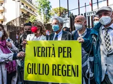 From left: Giulio's mother, Paola Regeni, the lawyer of the Regeni family, Alessandra Ballerini, Luigi Manconi, Marino Sinibaldi and Giulio's father, Claudio Regeni, with Italian journalists of the National Federation of the Italian Press hold banners reading 'the truth for Regeni' outside the court in piazzale Clodio in Rome, Italy, 25 May 2021. The preliminary hearing begins against four Egyptian security officers accused in 2016 of torture and murder in Cairo of an Italian student Giulio Regeni. ANSA / ANGELO CARCONI