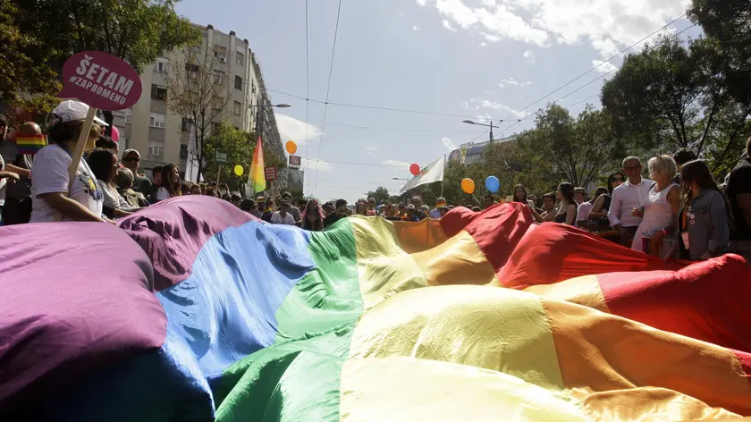 epa06210015 Participants of the Belgrade Pride Parade wave rainbow coloured flag in Belgrade, Serbia, 17 September 2017. Holding rainbow colored flags, balloons and banners with slogans such as 'For change' pride participants marched through the main streets of Serbia's capital in a rally supported by ILGA-Europe - the European Region of the International Lesbian, Gay, Bisexual, Trans and Intersex Association (ILGA). EPA/ANDREJ CUKIC