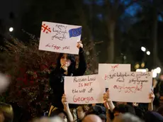 epa11282720 Georgian opposition party supporters attend a protest against a draft bill on 'foreign agents' near the Georgian Parliament in Tbilisi, Georgia, 16 April 2024. The Georgian parliament began considering a bill on 'foreign agents', which has been criticized by Western countries, prompting representatives of non-governmental organizations and the civil society to protest outside the parliament against the proposed law. EPA/DAVID MDZINARISHVILI