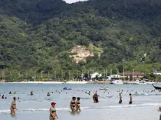 epa04538638 A photo made available on 23 December 2014 shows foreign tourists enjoy on the 2004 tsunami hit Patong beach, Phuket island, southern Thailand, 30 November 2014. Ceremonies across Phuket and Phang Nga are held to mark the ten year anniversary of the Boxing Day tsunami which struck 26 December 2004. More than 5,000 people were killed in Thailand, many of them foreigners vacationing in the area, among more than 280,000 who were killed or are missing as the devastating waves struck 14 nations on the Indian Ocean. EPA/YONGYOT PRUKSARAK