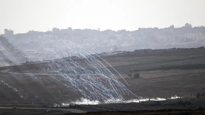 epa07104624 Tear gas fired by the Israeli army on Palestinian protesters across the border near the Neighborhood of Jabalia, during the Friday protest 19 October 2018. Reports state that Isreal's armed forces are on a high state alert at the Israel Border with Gaza after two missiles lunched from Gaza hit an Israeli house in the southern city of Beersheb on 17 October 2018. EPA/ATEF SAFADI