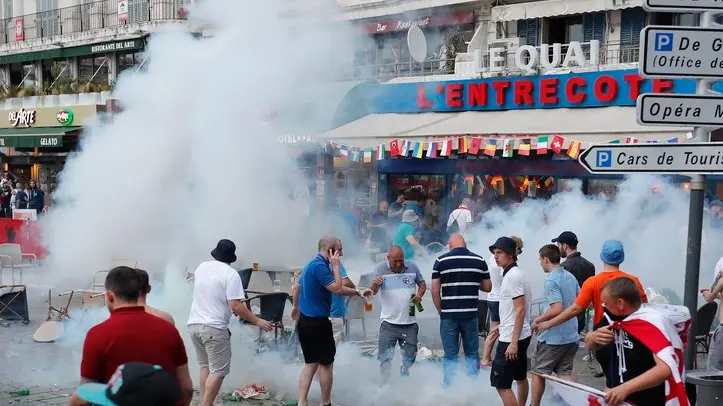 French police use tear gas against England supporters in downtown Marseille, France, Friday, June 10, 2016. Some minor scuffles on Friday and the brief clashes late Thursday revived bitter memories of days of bloody fighting in this Mediterranean port city between England hooligans, Tunisia fans and locals of North African origin during the World Cup in 1998, and raised fears of more violence ahead of Saturday's European Championship match between England and Russia at the Stade Velodrome. (AP Photo/Darko Bandic)
