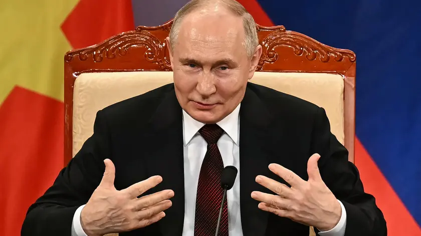 epa11424895 Russia's President Vladimir Putin speaks on stage during an event with Vietnam's President To Lam attended by the Vietnam Friendship Association and generations of Vietnamese alumni that studied in Russia at the Hanoi Opera House in Hanoi, Vietnam, 20 June 2024. Putin is on an official visit to Vietnam following his visit to North Korea. EPA/MANAN VATSYAYANA / POOL