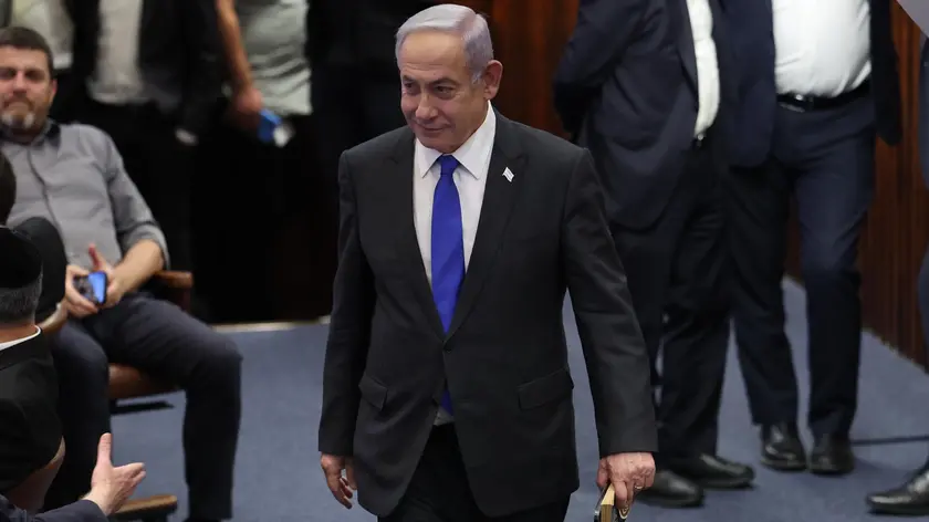 epa11403054 Israeli Prime Minister Benjamin Netanyahu (C) attends the Knesset plenum vote on the ultra-Orthodox conscription to military service law, in the Knesset, Israeli parliament in Jerusalem, 10 June 2024. The Knesset vote on the controversial exemption for ultra-Orthodox Yeshiva students from military conscription. Israel’s Supreme Court heard on 02 June a response by the state over the ultra-Orthodox recruitment issue, after previously extending a deadline for the government to present a conscription plan for ultra-Orthodox Jews, who are traditionally exempt from military service. EPA/ABIR SULTAN