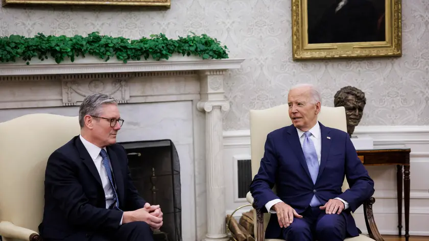 epa11471648 US President Joe Biden (R) and UK Prime Minister Keir Starmer (L) participate in a bilateral meeting at the Oval Office of the White House in Washington, DC, USA, 10 July 2024. Starmer stated he would publish a roadmap showing how the UK would spend 2.5 percent of its gross domestic product on defense as the prime minister faced calls from the British military and allies abroad to clarify his policy ahead of this week's NATO summit in Washington. EPA/TING SHEN / POOL