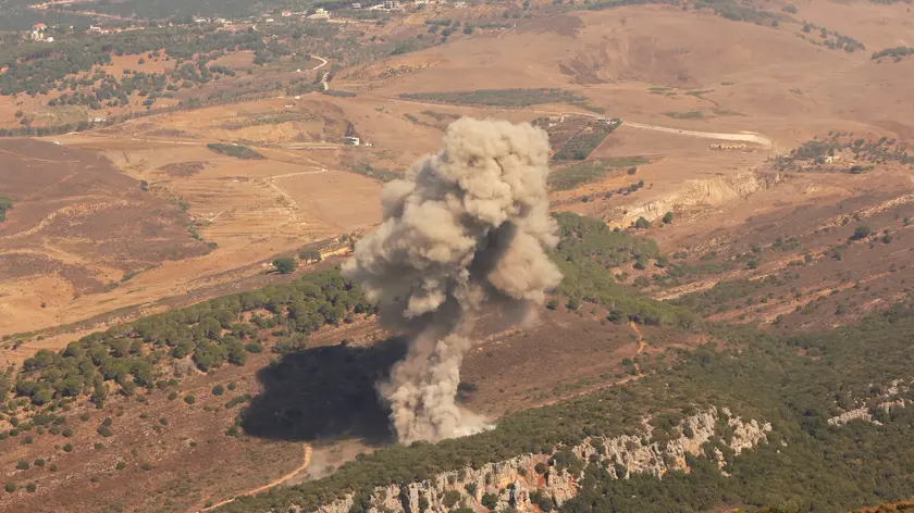 epa11621932 Smoke billows from the site of an Israeli airstrike that targeted Lebanese villages, as seen from Marjaayoun, southern Lebanon, 24 September 2024. Thousands of people fled southern Lebanon after an evacuation warning by the Israeli army, which on 23 September announced that it had launched 'extensive' airstrikes on Hezbollah targets in the country. According to Lebanon's Ministry of Health, at least 492 people have been killed and more than 1,645 have been injured following continued airstrikes on southern Lebanese towns and villages. EPA/STR