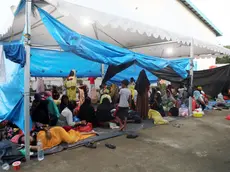 epa11036778 Rohingya refugees rest at a temporary shelter in Sabang, Aceh province, Indonesia, 19 December 2023. More than 150 Rohingya people, mostly women and children, are accommodated by the local government amid residents' protests about their presence. According to data by UNHCR, almost 1500 more Rohingya refugees have arrived in Indonesia's Aceh province since the beginning of November 2023, with several waves of voyages headed to Indonesia and Malaysia predicted for the year. EPA/HOTLI SIMANJUNTAK