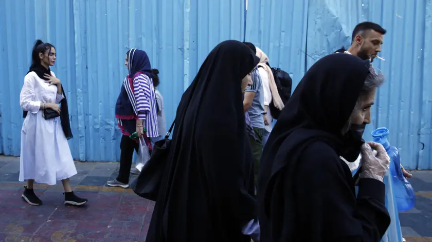 epa10858504 Iranian women, some without the mandatory headscarf, walk in a street in Tehran, Iran, 13 September 2023. Iranians are marking the first anniversary of Mahsa Amini's death which led to nationwide protests over the country's mandatory dress code (Hijab) law. Protests erupted after the death of 22-year old Iranian woman, Mahsa Amini, detained by morality police for not wearing the hijab properly in September 2022. Since then, a growing number of women in the country have been defying authorities by removing the headscarf. EPA/ABEDIN TAHERKENAREH