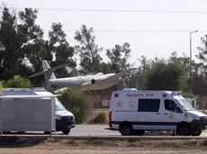 epa10992447 Ambulances enter Hatzerim Airbase during the preparations to receive the Israeli hostages held by Hamas after their release, in Hatzerim, Southern Israel, 24 November 2023. Israel and Hamas agreed to a 4-day ceasefire agreement, mediated by Qatar, the US, and Egypt, that came into effect at 05:00 AM GMT on 24 November, with 50 Israeli hostages, women and children, to be released by Hamas. And 150 Palestinian women and children that were detained in Israeli prisons to be released in exchange. More than 14.000 Palestinians and at least 1,200 Israelis have been killed, according to the Gaza Government media office and the Israel Defense Forces (IDF), since Hamas militants launched an attack against Israel from the Gaza Strip on 07 October, and the Israeli operations in Gaza and the West Bank which followed it. EPA/CHRISTOPHE PETIT TESSON