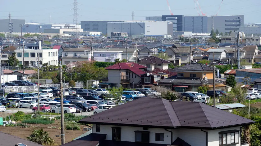 epa11287844 View of the industrial zone in the background at the town of Aikawa, Kanagawa Prefecture, near Tokyo, Japan, 16 April 2024 (issued 19 April 2024). Some 50 kilometers separate Tokyo from a small city whose rate of foreign residents is three times the national average and which, with foreigners from up to 45 countries, shows the most diverse face of Japan and the paradigm shift that the country is undergoing. It is Aikawa, a municipality of traditional Japanese houses and factories surrounded by mountains and with the highest proportion of foreign residents in Kanagawa Prefecture, which is also home to international cities such as the large Yokohama, Japan's second-largest city. Of the 39,427 inhabitants of Aikawa, 8.44 percent are foreigners, a percentage much higher than the national statistic (2.7 percent) in which Peruvian nationality predominates, followed by Vietnamese, Filipino and Brazilian. EPA/FRANCK ROBICHON