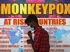 epa10334196 (FILE) - An Indian health worker walks in front of a list of high-risk countries for the Monkeypox virus, at Chennai International Airport, in Chennai, India, 16 July 2022 (reissued 28 November 2022). The World Health Organization (WHO) in a statement on 28 November 2022 said it "will begin using a new preferred term mpox as a synonym for monkeypox" simultaneously for one year until the term 'monkeypox' is phased out. The decsion was taken after consultations with global experts as "racist and stigmatizing language online, in other settings and in some communities was observed and reported to WHO." EPA/IDREES MOHAMMED