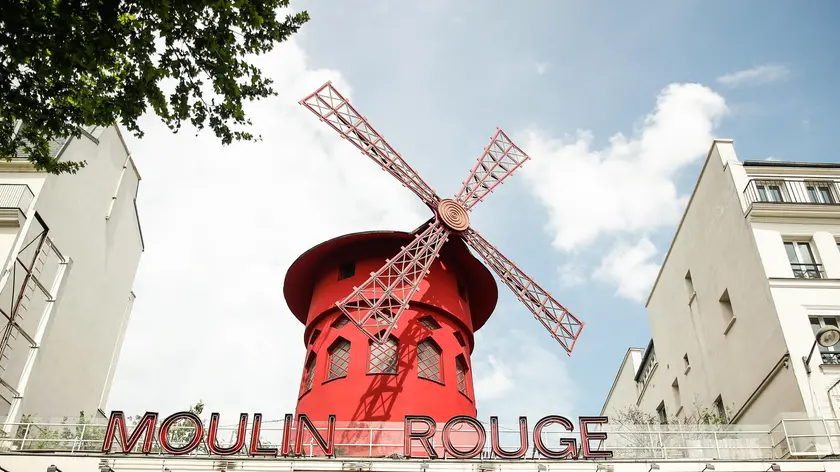 epa09928360 The mill that presides over the landmark 'Moulin Rouge' cabaret, in Paris, France, 04 May 2022 (issued 05 May 2022). For the first time in its 133-year history, the iconic Parisian cabaret 'Moulin Rouge' will open the doors of the famous mill that presides over the building to the public to turn it into a tourist accommodation, with the possibility of spending a night inside for one euro. EPA/Mohammed Badra