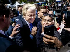 epa11391717 Party for Freedom (PVV) leader Geert Wilders poses for photos with supporters during an election campaign on the Hague Market, Netherlands, 05 June 2024. The PVV leader is campaigning for the European Parliament elections. This year's European Parliament elections are scheduled across EU member states from 06 to 09 June 2024. EPA/REMKO DE WAAL