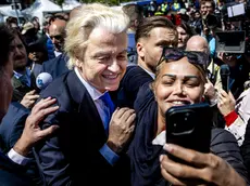 epa11391717 Party for Freedom (PVV) leader Geert Wilders poses for photos with supporters during an election campaign on the Hague Market, Netherlands, 05 June 2024. The PVV leader is campaigning for the European Parliament elections. This year's European Parliament elections are scheduled across EU member states from 06 to 09 June 2024. EPA/REMKO DE WAAL