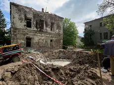 epa11304557 Communal workers operate at the site of a rocket attack on a regional psychiatric hospital in Kharkiv, northeastern Ukraine, 27 April 2024. According to the Regional Prosecutor's Office Russia hit the city with two missiles of the S-300 type from the territory of the Belgorod region. In total, Russia used 34 air, ground, and sea-based missiles for the night time shelling of Ukraine as Air Force Command of UA Armed Forces reported. 21 were shot down by Ukrainian troops. As a result of the attack, the enterprise equipment of the four thermal power plants was seriously damaged according to the DTEK Group energy holding report. EPA/SERGEY KOZLOV 50901