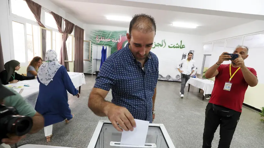 epa11590800 A voter casts his ballot at a polling station during a presidential election in Algiers, Algeria, 07 September 2024. According to the National Independent Authority for Elections (ANIE), more than 24 million Algerians are called to the polls to elect a new president of the republic for a five-year term. Three candidates are in the running for this election; the national secretary of the Socialist Forces Front (FFS), Youcef Aouchiche, the president of the Movement of Society for Peace (MSP), Abdelaali Hassani Cherif, and the current president, Abdelmadjid Tebboune. EPA/MOHAMED MESSARA