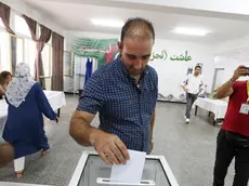epa11590800 A voter casts his ballot at a polling station during a presidential election in Algiers, Algeria, 07 September 2024. According to the National Independent Authority for Elections (ANIE), more than 24 million Algerians are called to the polls to elect a new president of the republic for a five-year term. Three candidates are in the running for this election; the national secretary of the Socialist Forces Front (FFS), Youcef Aouchiche, the president of the Movement of Society for Peace (MSP), Abdelaali Hassani Cherif, and the current president, Abdelmadjid Tebboune. EPA/MOHAMED MESSARA