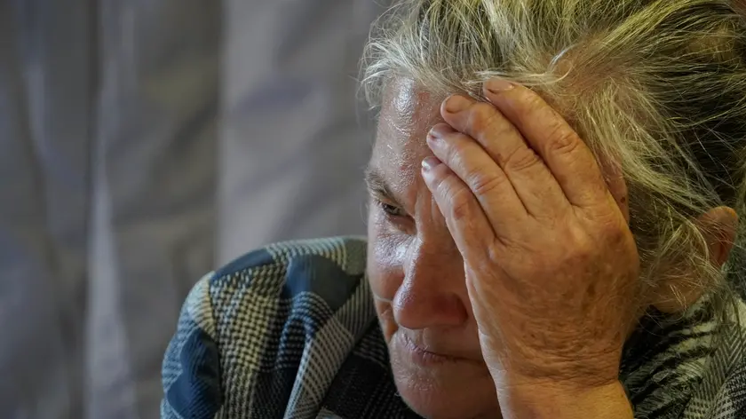 epa11596957 A woman evacuated from the Kursk regional border area with Ukraine, receives help from the Russian Red Cross in downtown Kursk, Russia, 10 September 2024. Fighting between Russian and Ukrainian forces has been ongoing in the Kursk region since 06 August following a Ukrainian military incursion into the Russian border region. Russian authorities have introduced a 'counter-terrorist operation' and federal emergency regimes in the region, and more than 121,000 people have been resettled from nine border areas. The Russian Defense Ministry reported on 10 September, that Ukrainian troops losses in the Kursk direction over the day amounted to more than 380 servicemen, and over the entire period of its military operations to more than 11,800 servicemen. EPA/STRINGER