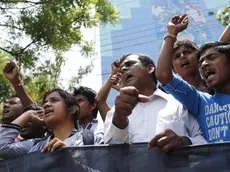 epa04176678 Leaders of garment wokers organizations and workers attend a protest rally demandig the full compensation for the dead and injured workers of the Rana Plaza building collapse in Dhaka, Bangladesh, 23 April 2014. The anniversary of the blaze at the Rana Plaza building, which left over 1,100 workers dead and about 2,500 rescued alive is coming up on 24 April 2013. The Rana Plaza disaster highlighted unsafe conditions for many of the four million workers in the South Asian country's garment industry. EPA/ABIR ABDULLAH