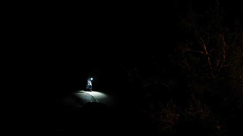 epa11384745 A woman walks with a flashlight in the dark in a residential area during an electricity blackout in Kyiv, Ukraine, 01 June 2024, amid the ongoing Russian invasion. Ukraine started cutting electricity following Russian rocket and drone shelling of critical infrastructure in several areas of Ukraine the previous night. Russian troops entered Ukrainian territory on 24 February 2022, starting a conflict that has provoked destruction and a humanitarian crisis. EPA/SERGEY DOLZHENKO