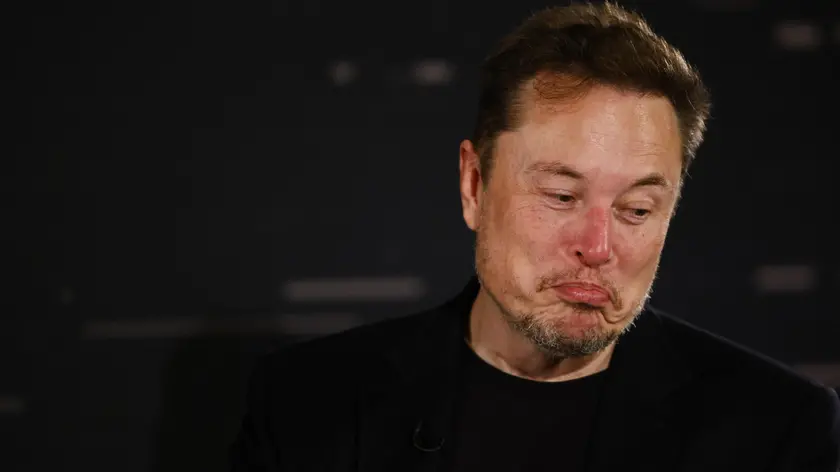 epa10955237 US tech entrepreneur Elon Musk reacts as he attends a conversation event with British Prime Minister Rishi Sunak (unseen) in central London, Britain, 02 November 2023. The conversation will be streamed on X (formerly Twitter) and follows the two-day AI Safety Summit that was held at Bletchley Park. EPA/TOLGA AKMEN / POOL