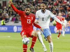 epa10547945 Switzerland's defender Ricardo Rodriguez (L) fight for the ball with Israel's midfielder Sagiv Jehezkel (R) during the UEFA EURO 2024 qualifying group I soccer match between Switzerland and Israel, in Geneva, Switzerland, 28 March 2023. EPA/SALVATORE DI NOLFI
