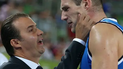 Italy's coach Simone Pianigiani, left, speaks to his player Marco Cusin during a EuroBasket European Basketball Championship Group F match against Croatia at the Stozice Arena, in Ljubljana, Slovenia, Saturday, Sept. 14, 2013. (AP Photo/Thanassis Stavrakis)