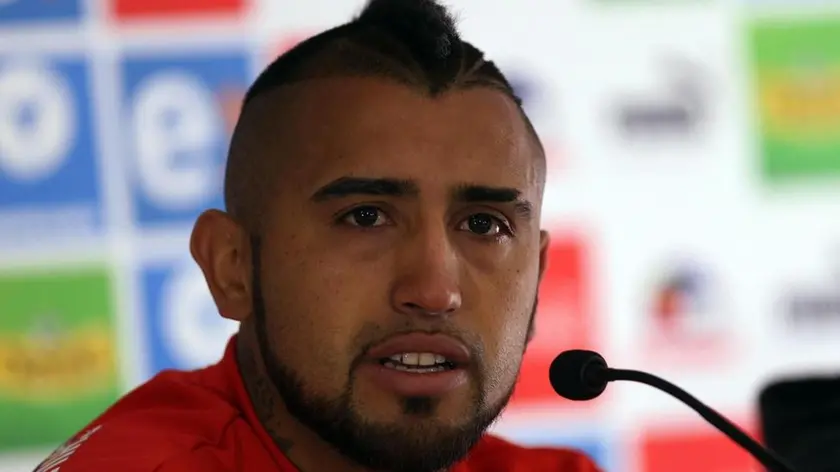 epa04805175 Chilean national team player Arturo Vidal talks during a press conference at complex Fernando Riera in Santiago, Chile, 17 June 2015. Vidal, who was involved in a car accident this Tuesday night, was freed due a court decision this morning, while Chilean coach Jorge Sampaoli said he will not be expelled out of the team, for they upcoming Copa America 2015 match against Bolivia on next 19 June. EPA/Elvis Gonzalez
