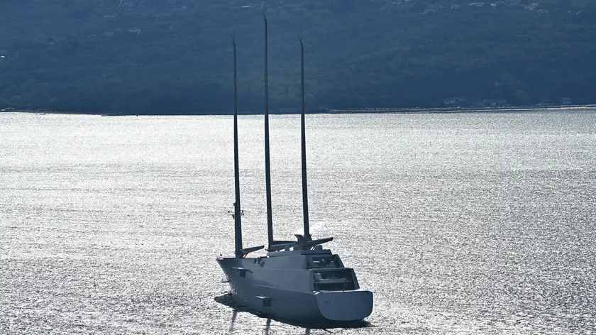 The largest sailing yacht in the world 'A' property of Andrey Melnichenko, overlooks hundreds of sailing boats as they crowd the Gulf of Trieste at the start of the 54th edition of the traditional 'Autumn Cup - Barcolana' regatta in Trieste, Italy, 09 October 2022. ANSA/LUCA ZENNARO