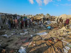epa11586189 Internally displaced Palestinians inspect destroyed shelters following an Israeli military strike near Al-Aqsa Martyrs Hospital in Deir Al Balah, central Gaza Strip, 05 September 2024. According to the Palestinian Ministry of Health in Gaza, more than four Palestinians were killed after an Israeli air strike hit near the hospital. The Israeli military stated that it conducted a 'targeted' airstrike overnight on a 'Command and Control Center' used by Hamas and Islamic Jihad, which was embedded in the humanitarian area in Deir Al Balah, to 'remove an immediate threat', adding that prior to the strike 'numerous steps' were taken to mitigate the risk of harming civilians. More than 40,000 Palestinians and over 1,400 Israelis have been killed, according to the Palestinian Health Ministry and the Israel Defense Forces (IDF), since Hamas militants launched an attack against Israel from the Gaza Strip on 07 October 2023, and the Israeli operations in Gaza and the West Bank which followed it. EPA/MOHAMMED SABER