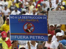 epa11292583 Opposition demonstrators take to the streets to protest against the government of Colombian President Gustavo Petro in Medellin, Colombia, 21 April 2024. Opposition supporters demonstrated in several Colombian cities, protesting against government health policies and calling for a constituent assembly. The placard reads 'No to the destruction of Colombia. Petro out!'. EPA/Luis Eduardo Noriega Arboleda