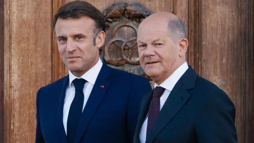 epa11376268 French President Emmanuel Macron (L) and German Chancellor Olaf Scholz arrive for a family photo at Meseberg Palace in Meseberg near Gransee, Germany, 28 May 2024. French President Emmanuel Macron visits Germany from 26 to 28 May. French President Emmanuel Macron visits Germany from 26 to 28 May. After appointments with Federal President Steinmeier in German regions Berlin, Dresden and Muenster, Macron meets German Chancellor Olaf Scholz at Meseberg Palace on 28 May 2024 for a Franco-German Council of Ministers. EPA/CLEMENS BILAN