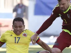 Colombian striker Carlos Bacca (L) fights for the ball with Venezuelan defender Andres Jose Tunez, during the Copa America 2015 Group C soccer match between Colombia and Venezuela, at Estadio El Teniente in Rancagua, Chile, 14 June 2015. EFE/Kiko Huesca