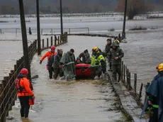 epa11404891 Carabineros and emergency personnel evacuate people who were isolated due to the overflowing of the Pichilo River, as a result of heavy rains in the Los Guzmanes sector, in the commune of Arauco, Bio Bio region, Chile, 11 June 2024. EPA/Ignacio Vasquez