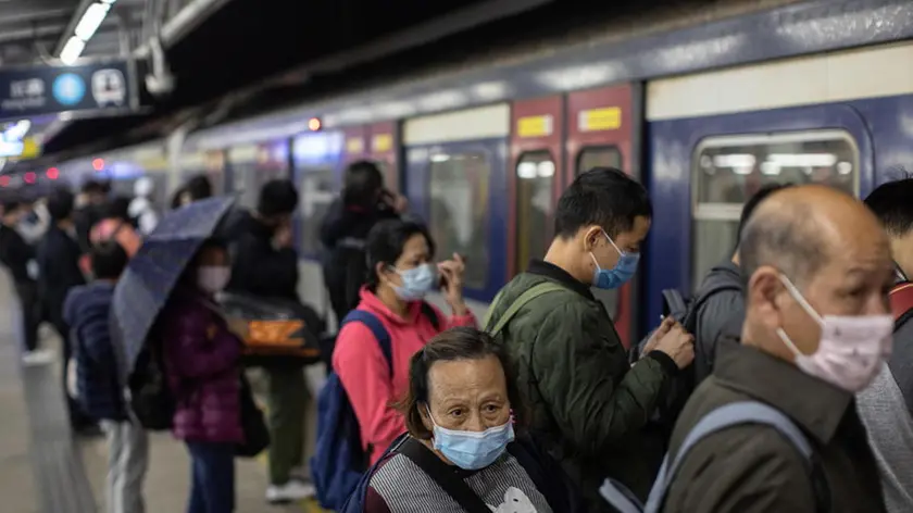 epa08190679 Passengers wear face masks as they prepare to board a Hong Kong bound train at Lo Wu MTR station hours before the closing of the Lo Wu border crossing in Hong Kong, China, 03 February 2020. Hong Kong has announced the closure of the major land border crossings at Lo Wu and Lok Ma Chau to shut out the outbreak of the Wuhan coronavirus. Only Hong Kong International Airport, the Shenzhen Bay joint checkpoint and the Hong Kong-Zhuhai-Macau Bridge remain open. The outbreak originated in the Chinese city of Wuhan and has so far killed at least 361 people with over 17,000 infected, mostly in China. EPA/JEROME FAVRE