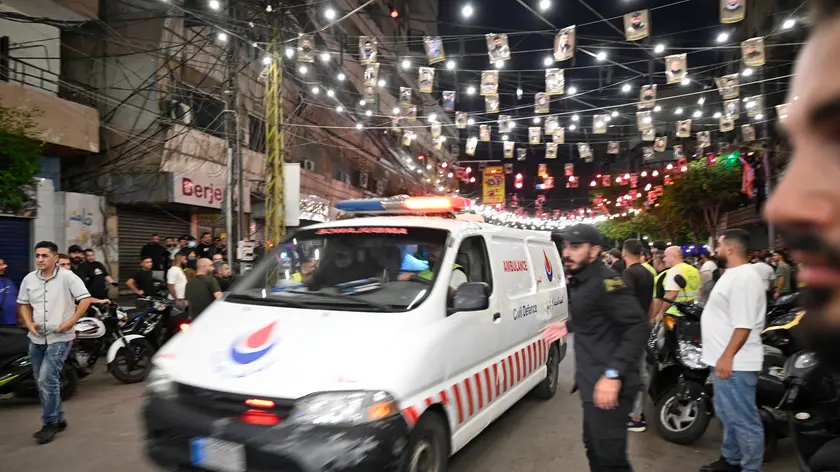 epaselect epa11621082 An ambulance drives at the southern suburb of Beirut after an Israeli military strike, in Beirut, Lebanon, 23 September 2024. The Israeli Defense Forces (IDF) said they conducted a 'targeted strike' in Beirut on 23 September after the Israeli military announced that it launched 'extensive' airstrikes on Hezbollah targets in Lebanon. Lebanese residents of villages in the Beqaa Valley 'who are inside or near houses where rockets and weapons are stored' have been warned to 'move away immediately! For your safety and protection', the statement added. According to Lebanon's Ministry of Health, at least 274 people have been killed and more than 1,000 others injured following continued Israeli airstrikes on southern Lebanese towns and villages since 23 September morning. EPA/WAEL HAMZEH