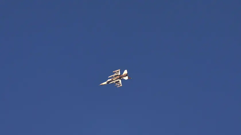epa11465739 An Israeli fighter jet flies over an area in southern Lebanon, as seen from an undisclosed location in northern Israel, 07 July 2024. The Israeli military stated on 07 July, that its Aerial Defense Array intercepted a 'suspicious aerial target' in the area of the Golan Heights that crossed from Lebanese territory. EPA/ATEF SAFADI