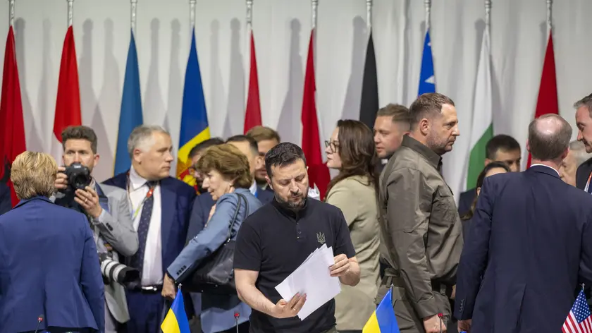 epaselect epa11415643 President Volodymyr Zelensky of Ukraine (C) holds sheets of paper at the plenary session of the Summit on Peace in Ukraine in Stansstad near Lucerne, Switzerland, 16 June 2024. International heads of state gathered on 15 and 16 June at the Buergenstock Resort in central Switzerland for the two-day Summit on Peace in Ukraine. EPA/URS FLUEELER / POOL EDITORIAL USE ONLY EDITORIAL USE ONLY